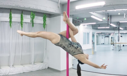 Pole gymnastics in the gym: it's not just dance, but strength.--pole gymnastics