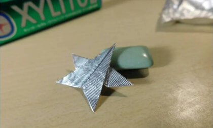 Small star(five-pointed) by folding origami with a gum wrapper.