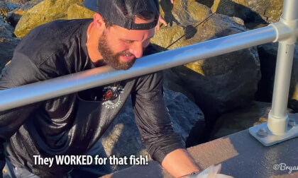 Guy Catching Fish With Help!