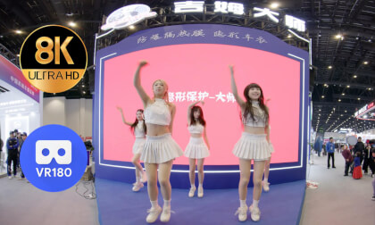 Girls dancing on a triangular stage