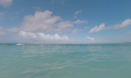360 VR Family with child bathing in ocean and taking video of vacation on Mauritius Island