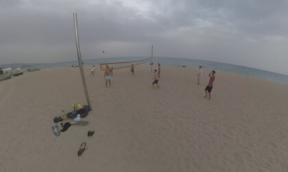 360 VR Barcelona coast with houses, railway and people playing volleyball 360 VR Barcelona coast with houses, railway and people playing volleyball
