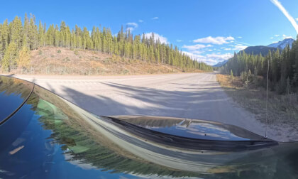 Drive from Canmore, Alberta down a Valley in the Rockies, through the foothills and out on to the Praires (8k, 360)
