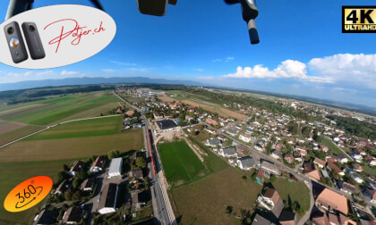 Drone flight 360° VR with arriving train over the village Bätterkinden directly the Emme in the administrative district Emmental - enjoy Switzerland from above Drone flight 360° VR with arriving train over the village Bätterkinden directly the Emme in the administrative district Emmental - enjoy Switzerland from above