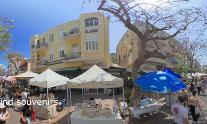 Nahalat Binyamin on Fridays is one of Tel Aviv’s liveliest weekly experiences — a mix of an outdoor arts‑and‑crafts fair, street performances, historic architecture, and the energy of the nearby Carmel Market.