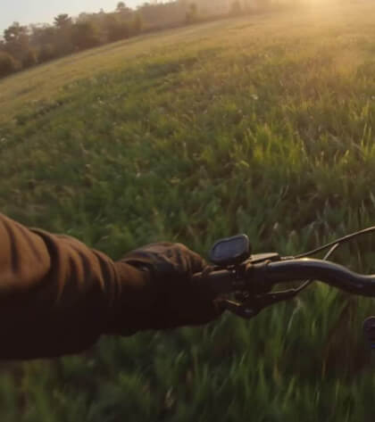 First-Person_Bicycle_Ride_A_medium_shot_shows_a_man_in_a_suit_walking_sbefN593
