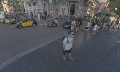 360 VR Cityscape of Barcelona with busy La Rambla and transport traffic on the roads