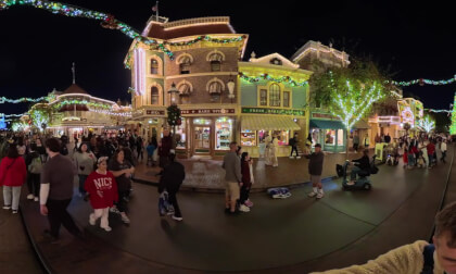 15.2 Walking past Christmas tree on Disneyland's Main Street toward magic castle (at night with Clare and Patrick)
