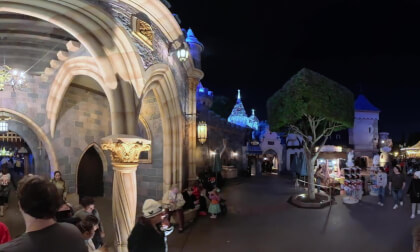17.1 Walking out through Disneyland's Magic Castle from near carousel toward Main Street with Clare and Patrick
