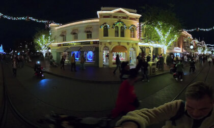 23.1 Walking (solo) on Main Street toward Disneyland's Magic Castle to Partners statue at night