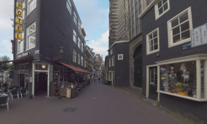 360 VR Amsterdam street and alley leading to Dam Square, Netherlands