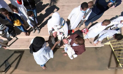Breaking news: Look downwards to see Christian Eritrean pilgrims baptize babies in Jordan River 360VR VR Video Breaking news: Look downwards to see Christian Eritrean pilgrims baptize babies in Jordan River 360VR VR