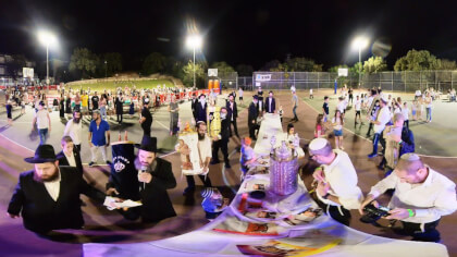Breaking news: Rabbi prays then men women and children dancing with Bible scrolls during the ceremony of Hakafot 360VR