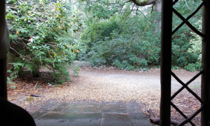 Sitting in a shelter watching the rain in Sheffield park and gardens Sussex