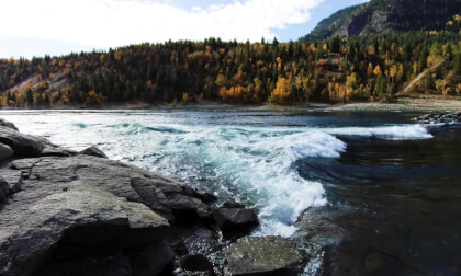 Two Kayakers and Rapids