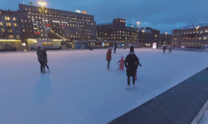 360 VR Railway Station and people on skating rink in evening Helsinki, Finland
