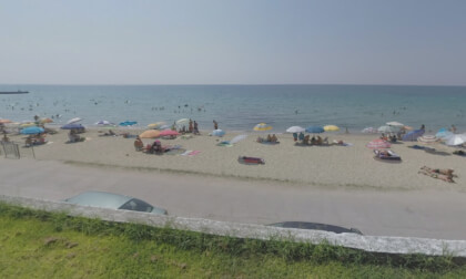 360 VR Seafront street and people sunbathing at beach in Nea Kallikratia, Greece