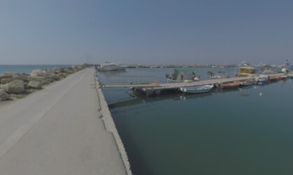 360 VR Sea shore with harbour and people relaxing at beach, Greece