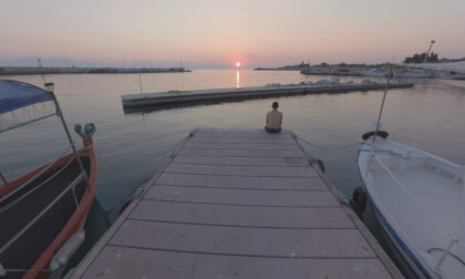360 VR Quay with tied up boats at sunset. Man sitting on the pier VR Video 360 VR Quay with tied up boats at sunset. Man sitting on the pier VR