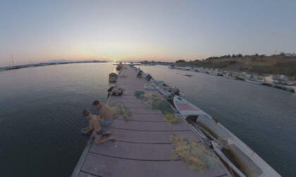 360 VR Harbour at sunset. Father and son on the pier with fishing nets 360 VR Harbour at sunset. Father and son on the pier with fishing nets