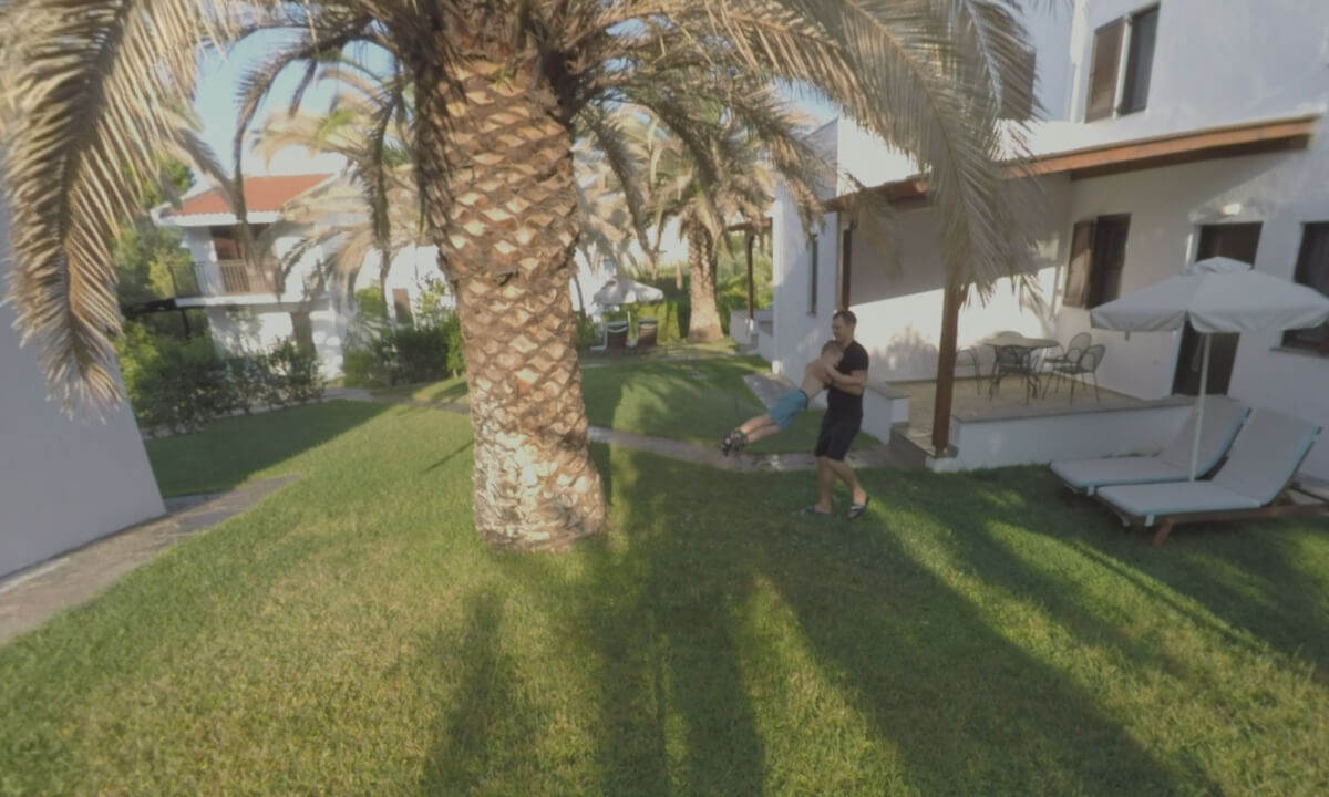 360 VR Dad and son walking outdoor at Trikorfo Beach resort, Greece