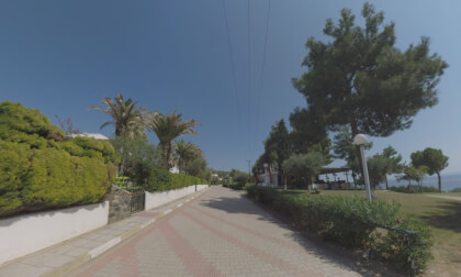 360 VR Paved street with villas near the sea, Greece