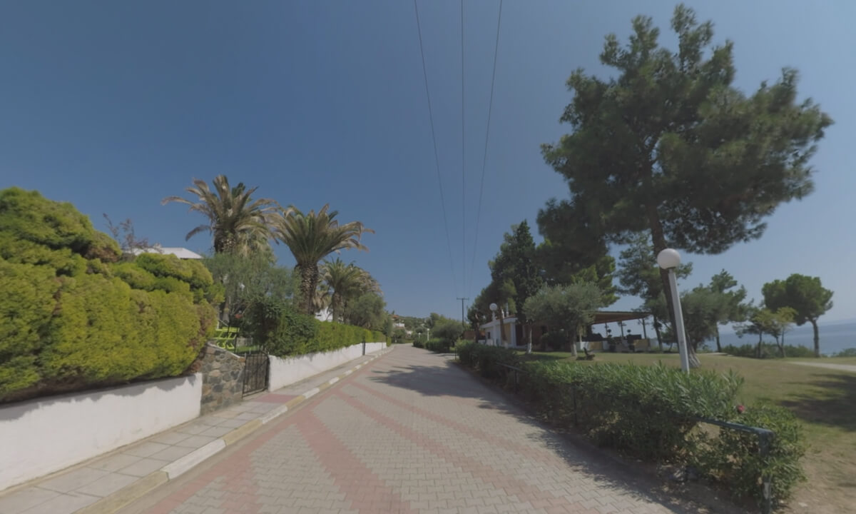 360 VR Paved street with villas near the sea, Greece