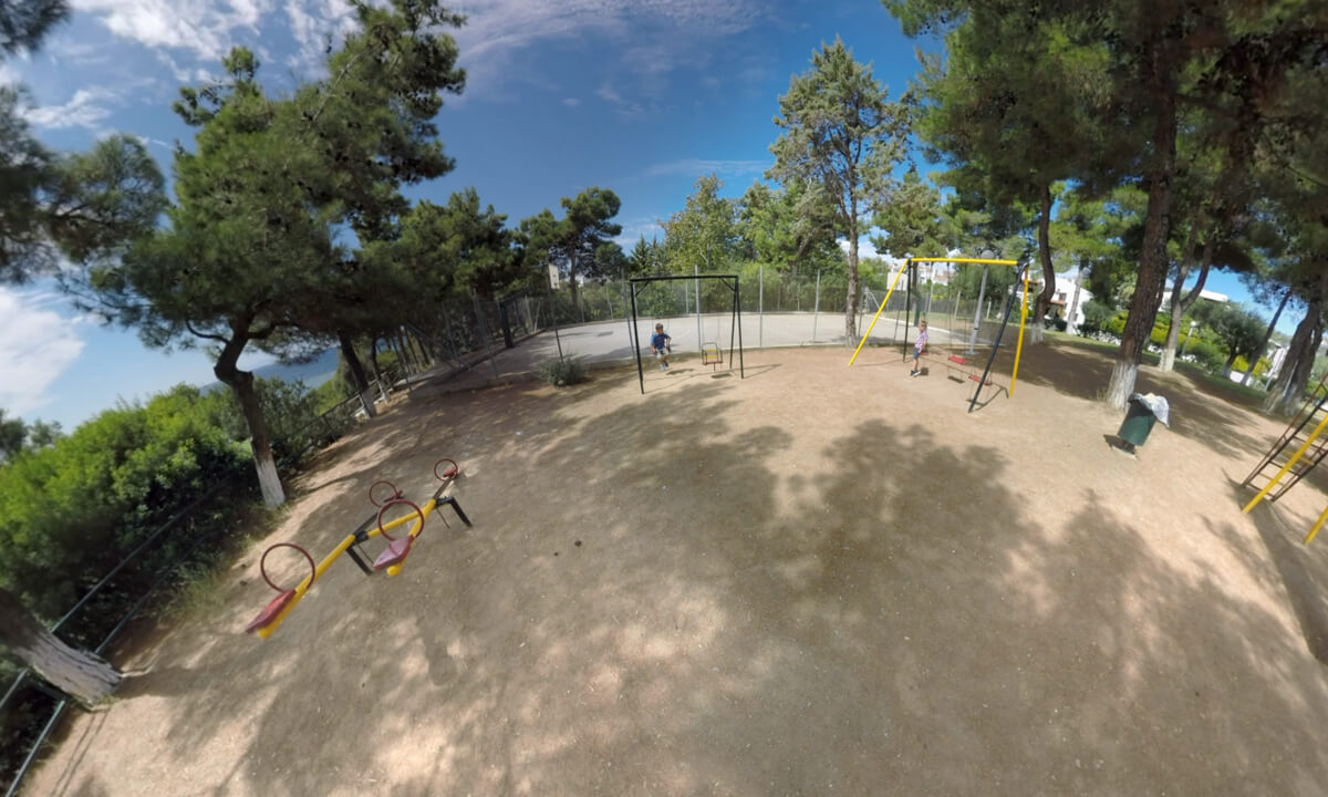 360 VR Kids on playground of Trikorfo Beach apartment hotel, Greece
