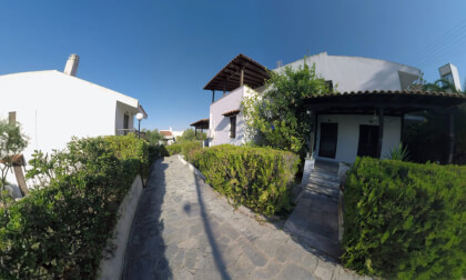 360 VR Trikorfo Beach villas with paved path and green hedges, Greece