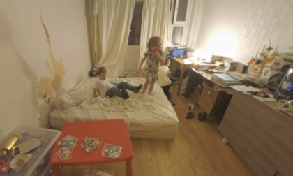 360 VR Children having fun and jumping on the bed at home 360 VR Children having fun and jumping on the bed at home
