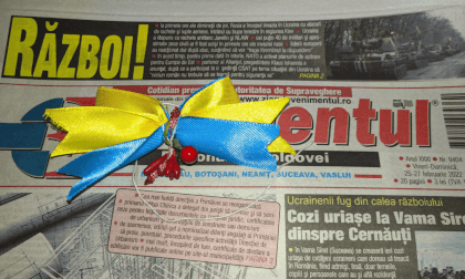 Ukrainian Babusia sews an Ukrainian colors bow-knot to my bag belt Ukrainian Babusia sews an Ukrainian colors bow-knot to my bag belt