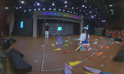 Yixuan flies paper airplanes