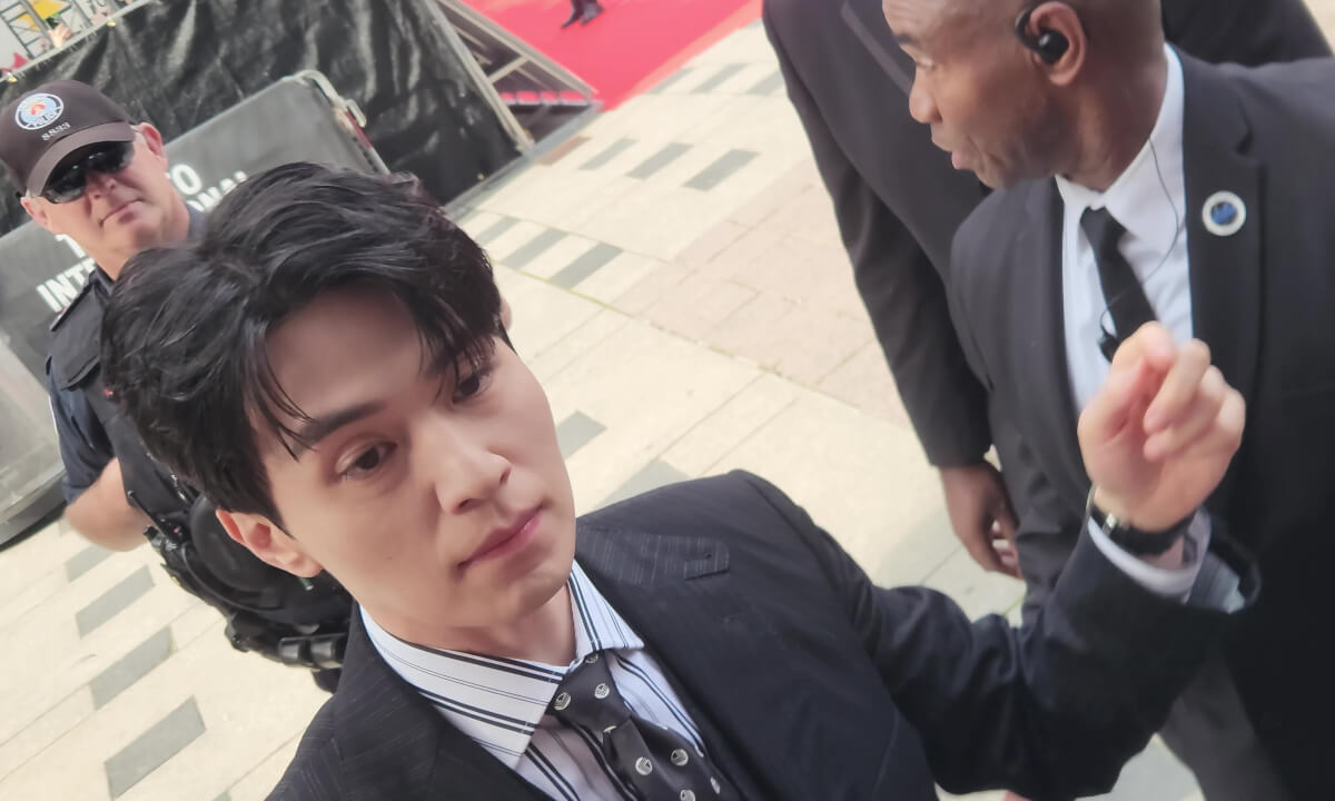 Lee Dong-wook at the Toronto International Film Festival (TIFF) red carpet signing autographs.