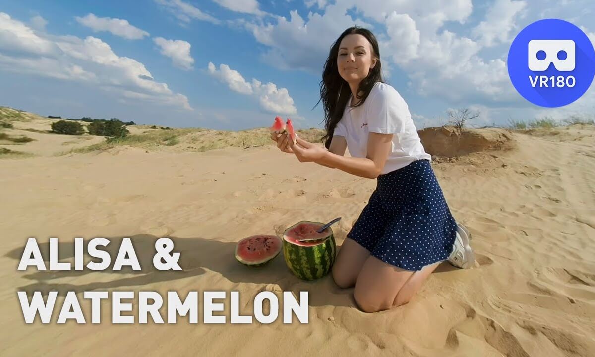 Pretty teen girl eats watermelon in the desert
