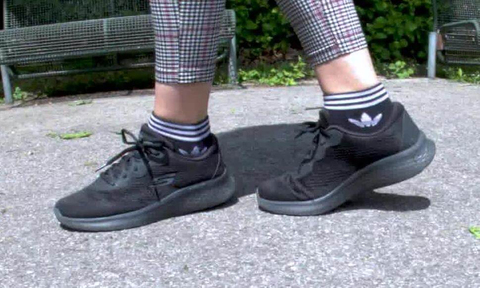 Model Maria shows you her favorite shoes, her black Skechers sneakers worn with adidas socks