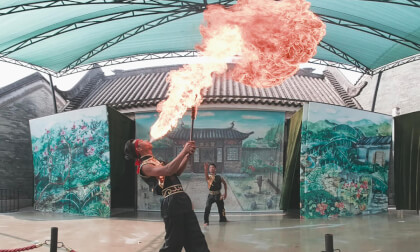 Acrobatics perform barefoot stepping on blades