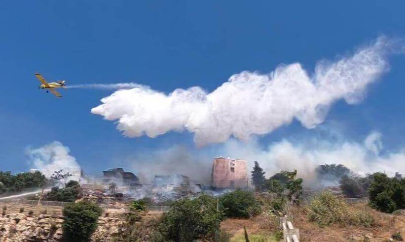Two Firefighting aircrafts (coming from the right) deployed to spray fire-retardants over blaze 360VR