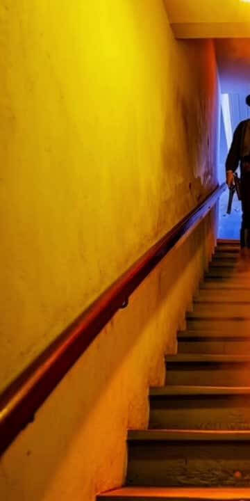 Billy the Kid shoots down the famous staircase