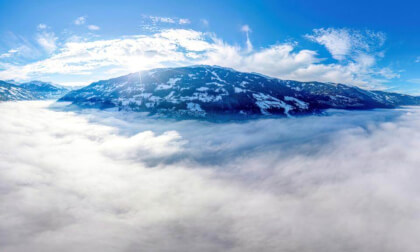 Zillertal above the thick fog in the valley - Tyrol, Austria.