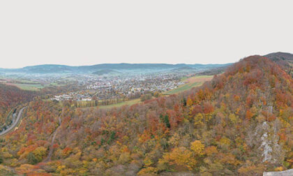 The City in the Jura Area - Delemont in Fall by air with old Abbey and Castle Ruin