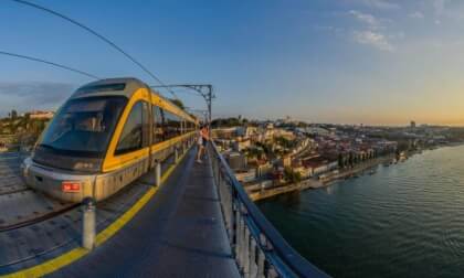 Sunset in Porto seen from the Dom Luís I Bridge (Ponte Luís I) - a double-deck metal arch bridge spanning the Douro River.