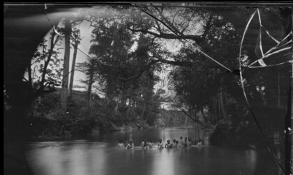 1864: North Anna River, Virginia. Soldiers bathing. Ruins of Richmond & Fredericksburg railroad bridge in the distance.
