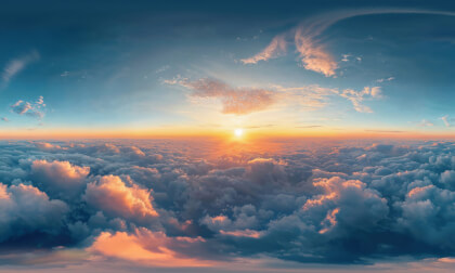 Flying Over Clouds At Sunset