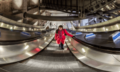 Woman in red at Westminster Underground Station